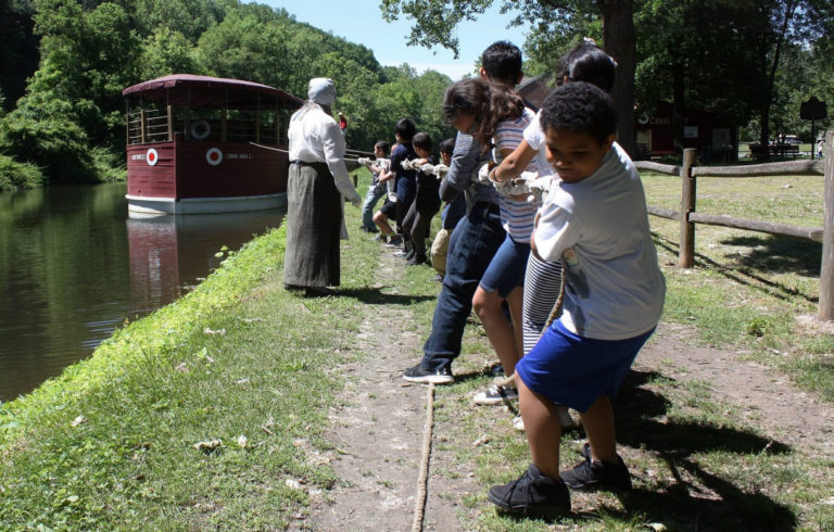 Students pull a canal boat