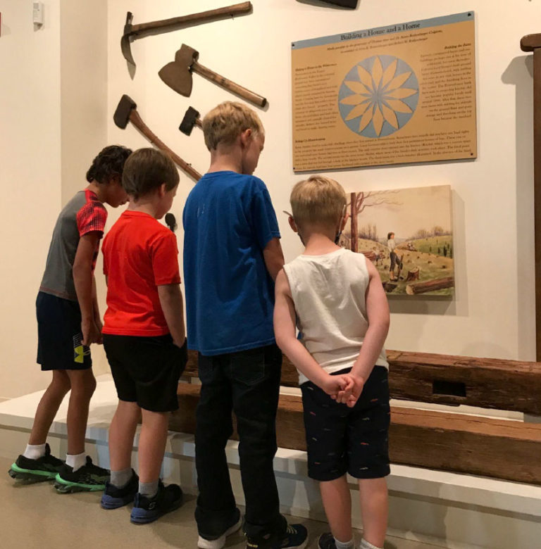 Students examine an exhibit at the Schwenkfelder Library & Heritage Center